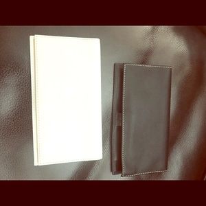 Two Coach check book cases